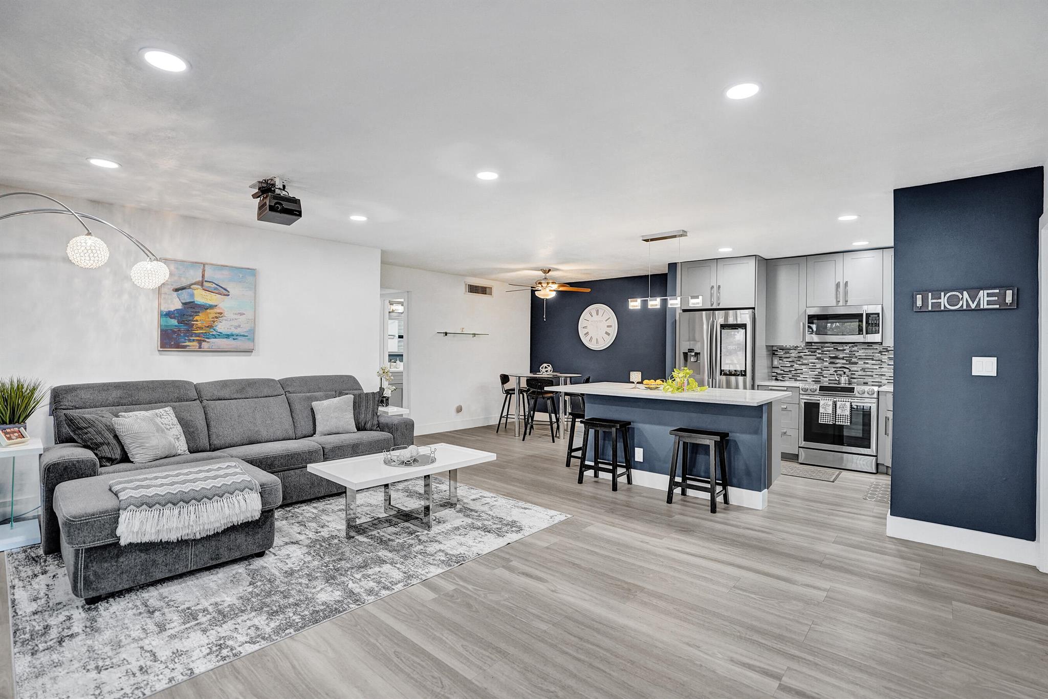 STUNNING FULLY RENOVATED CONDO IN PRIME DELRAY BEACH LOCATION! 2 miles to the beach and only minutes to Atlantic Ave, Whole Foods, shops & the best restaurants! Your sun-lit 2B/2B features oversized windows and a sleek new kitchen with quartz counters & island, high-end Samsung appliances, farmhouse sink & LED-lit cabinets. Seller spared no expense with new luxury flooring, modern bathrooms, smart thermostat and recessed lighting throughout! The primary suite offers generous space, a large walk-in closet, and jacuzzi! Enjoy a newer A/C, full size-washer dryer with storage & a relaxing patio with new enclosure! This unit has it all! Located in a well-cared for community with a sparkling pool, 2024 roof, and clubhouse. A TRUE GEM OFFERING LUXURY, COMFORT & UNBEATABLE VALUE NEAR EVERYTHING!