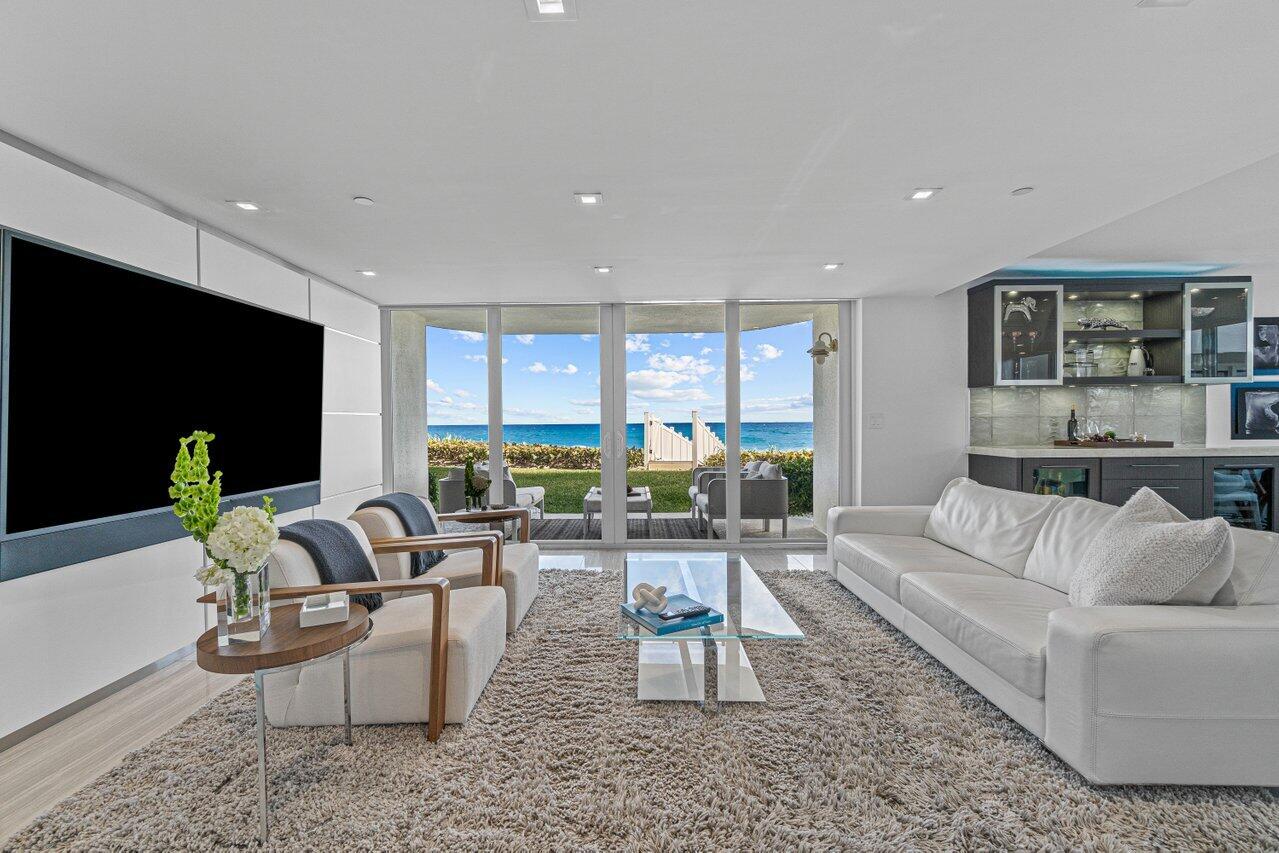 A RARELY AVAILABLE OPPORTUNITY to own a truly unique Oceanfront Walk-out Condo. Purely private with absolutely stunning panoramic Ocean views! Walk out your patio doors with direct access to a private beach.This Move-in ready fully automated smart home has been completely renovated with luxurious finishes. Equipped with Hurricane windows and doors. Beautiful custom High end woodwork and cabinetry, elegant flooring, Wolf/Subzero Kitchen appliances, Quartzite and Marble countertops throughout. The owner paid attention to all details during the renovation including; New HVAC and ducts, New electrical wiring and electrical box, New light fixtures, New plumbing, New high end plumbing fixtures, New fire sprinklers, and New fire rated front entry door. Lives like a private home on the beach.