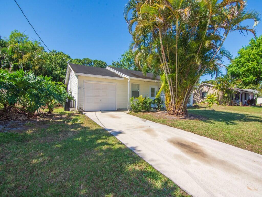 This charming 2 bedroom, 2 bathroom home in Port St. Lucie offers a perfect blend of comfort and modern elegance. As you step inside, you're greeted by a spacious living area adorned with uniform tile flooring that flows seamlessly throughout the home, creating a clean and cohesive aesthetic. The kitchen features stainless steel appliances Updated cabinets provide ample storage space, with granite countertops offer both style and durability. Whether you're preparing a quick breakfast or hosting a dinner party, this kitchen is sure to impress. Both bedrooms boast generous proportions and are complemented by their own walk-in closets, and bathrooms providing plenty of room for storage and organization. The rear boasts a large fenced yard