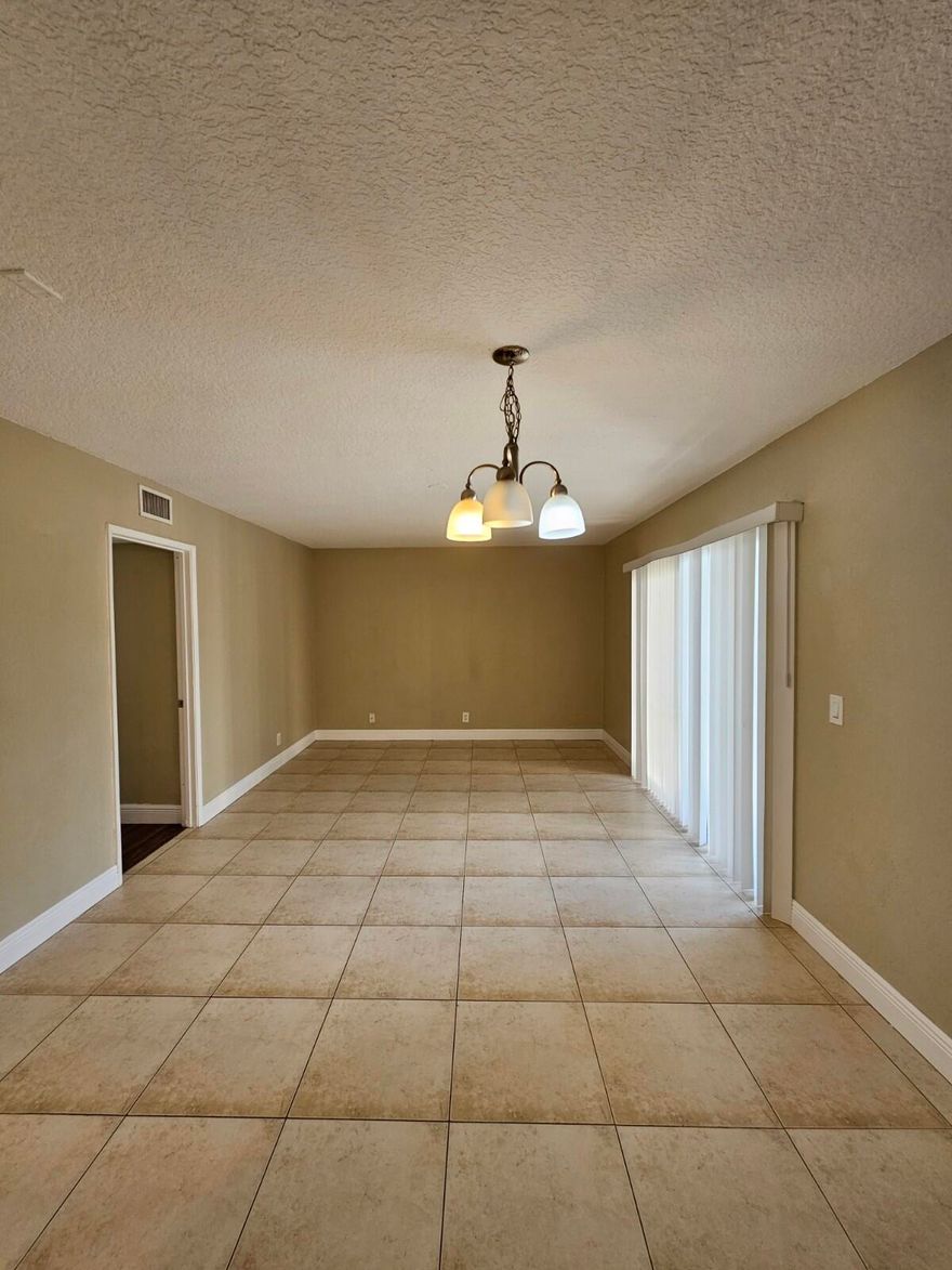 Beautiful and spacious 2-bedroom, 2-bath condo located in Palm Beach Place. This first-floor unit has been nicely updated with stainless steel appliances and granite countertops in the kitchen. The living area features tile flooring, while both bedrooms offer brand-new laminate floors. Centrally located just minutes from Okeechobee Blvd, the Turnpike, and SR-441, with quick access to major roads and highways. Benoist Farms Elementary School is within walking distance, making this home especially convenient for families. A great opportunity—this unit won't last long. Don't miss the chance to make it your new home.