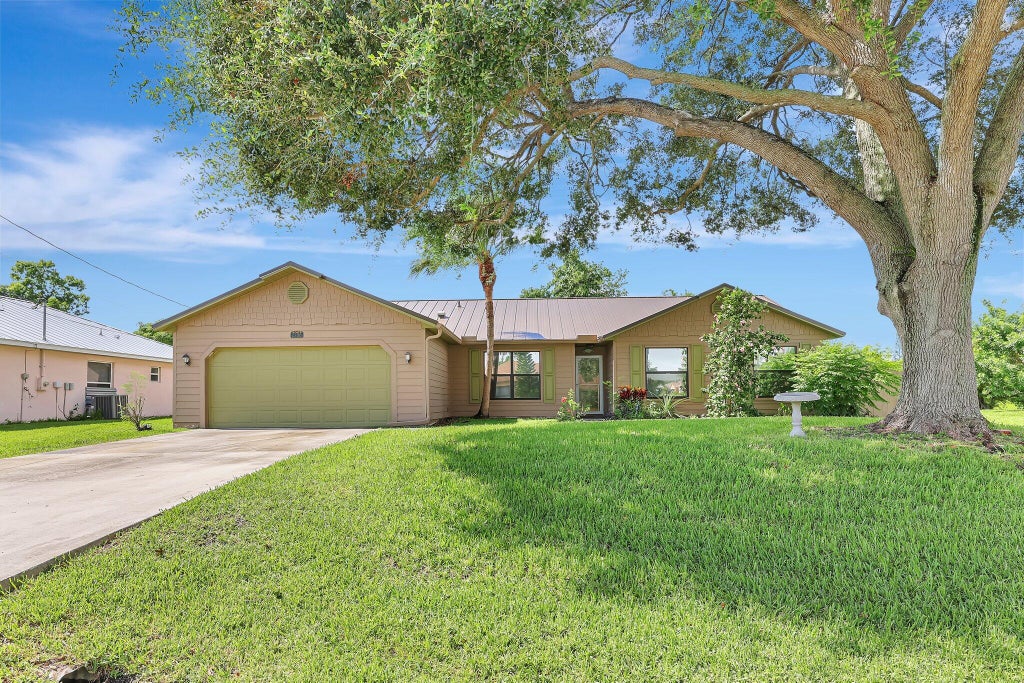 Photo of 2286 SW Jay Avenue, Port Saint Lucie, FL 34953 (MLS # R11010893)