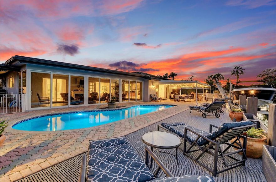 Best-priced renovated home in Lake Estates! Act fast—make a full-price offer and the seller will leave the 2009 Robalo boat in pristine condition! This stunning 4-bedroom, 3-bath property has been fully updated with a new roof, New Awning, 2019 AC, PVC plumbing, hurricane-impact windows and doors, boat lift, plus a brand-new kitchen and bathrooms. Designed for entertaining, the layout seamlessly blends indoor and outdoor living. With 80 feet of waterfront, you'll enjoy a prime location close to top-rated schools, great amenities, and everything you need. There is one fixed bridge at high tide you have 6’ clearance. This move-in-ready gem won’t stay on the market long!