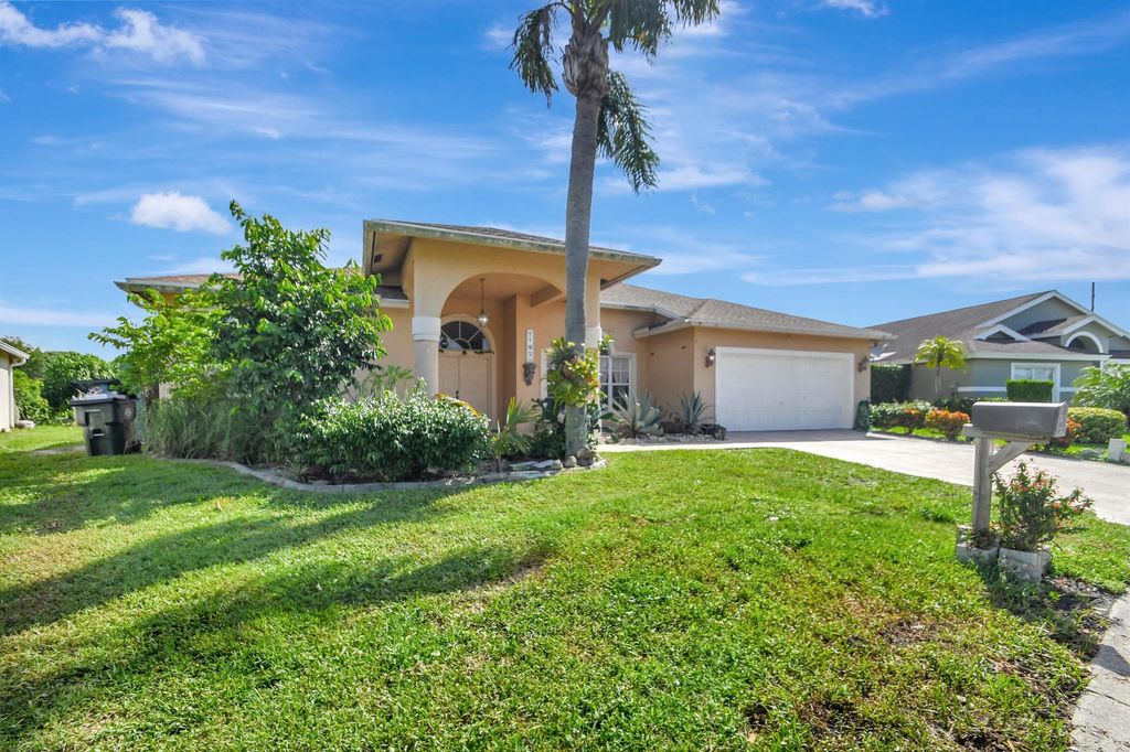 Photo of 1192 W Hatteras Circle W, Greenacres, FL 33413 (MLS # R11002086)