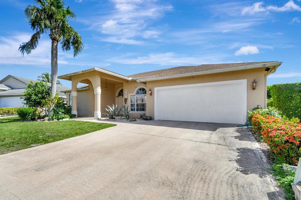 Photo of 1192 W Hatteras Circle W, Greenacres, FL 33413 (MLS # R11002086)