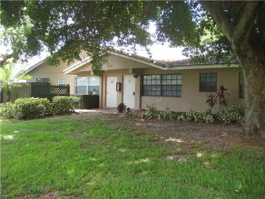 Peaceful lakefront 2 bedroom 2 bath unit in quad-plex **UNIT 11411** located in Coral Springs. Bright living room with a big window & dining space leads into kitchen area. Tile floors throughout. Crown molding in dining area. On site Laundry Room. Recentl y painted and updated.