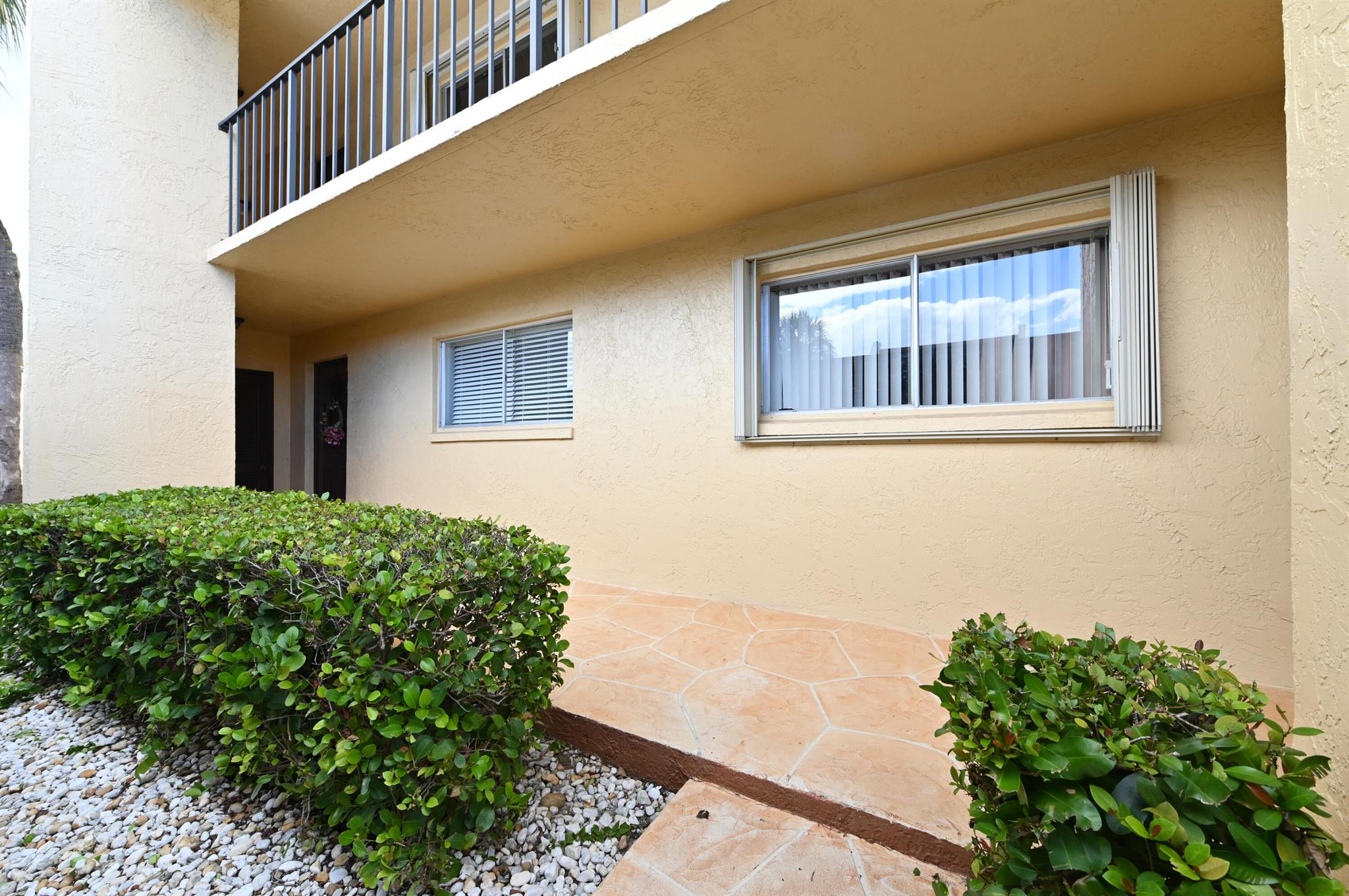 Welcome to 2905 SW 22nd Ave, Unit 1080, located in Sabal Pine East, an all-ages community ideally located in Delray Beach. This 2-bedroom, 2-bathroom, first floor condo combines comfort with convenience. The residence features a spacious living and dining area and a renovated kitchen and bathrooms. The split-bedroom layout provides privacy, with the primary suite including a private bath. Additional highlights include in-unit laundry, covered parking, and tile and vinyl flooring. Both the air conditioning and hot water heater are updated as well (2022). Sabal Pine East offers residents a well-maintained community with amenities such as a pool and tennis courts.