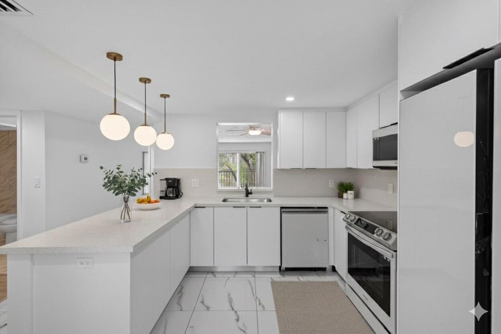 Photo of 14375 Strathmore Lane #303, Delray Beach, FL 33446 (MLS # B26013420)