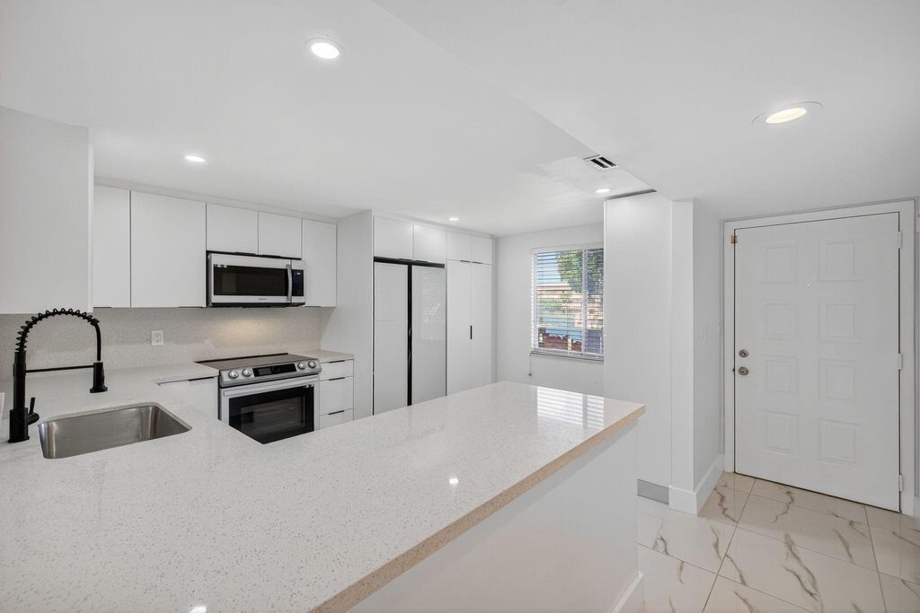 Photo of 14375 Strathmore Lane #303, Delray Beach, FL 33446 (MLS # B26013420)