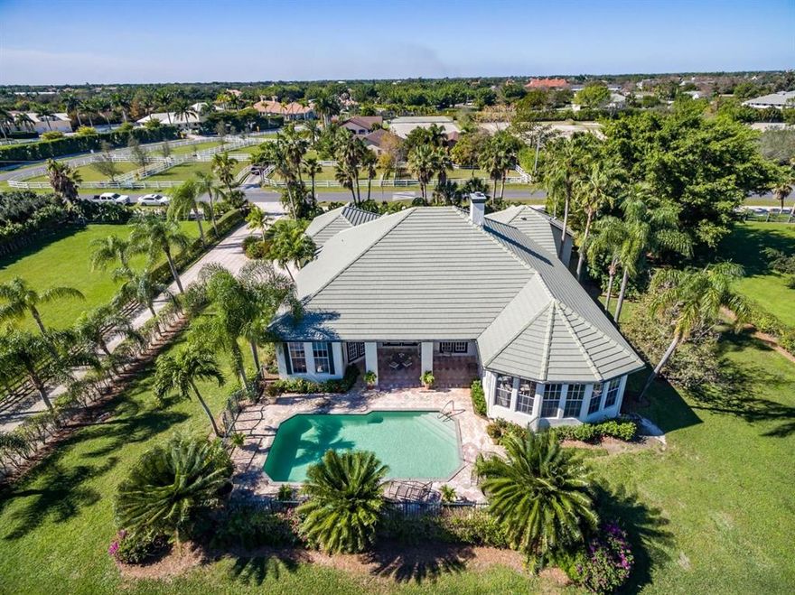 The lowest priced property in desirable Saddle Trail Park South, this just over 5-acre estate offers so much potential. Within a 5 minute hack to the Winter Equestrian Festival showgrounds. This private equestrian estate comes complete with pool, 6 paddocks, riding ring, 5-stall barn, tack-room, and feed area.  The lot size allows for the construction of a 20-stall barn with 5 grooms quarters.