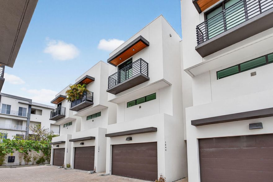 Experience the perfect blend of modern design, prime location, and effortless luxury. Built in 2022, this stunning townhouse features a bright, airy open-concept floor plan with sleek finishes throughout. Offering 3 bedrooms, each with en suite baths, plus a half bath for guests. The chef-inspired kitchen showcases premium appliances, modern cabinetry, and elegant surfaces that elevate the entire space. Ideally located less than 10 minutes from the beach and downtown Fort Lauderdale, placing dining, shopping, and entertainment right at your fingertips.