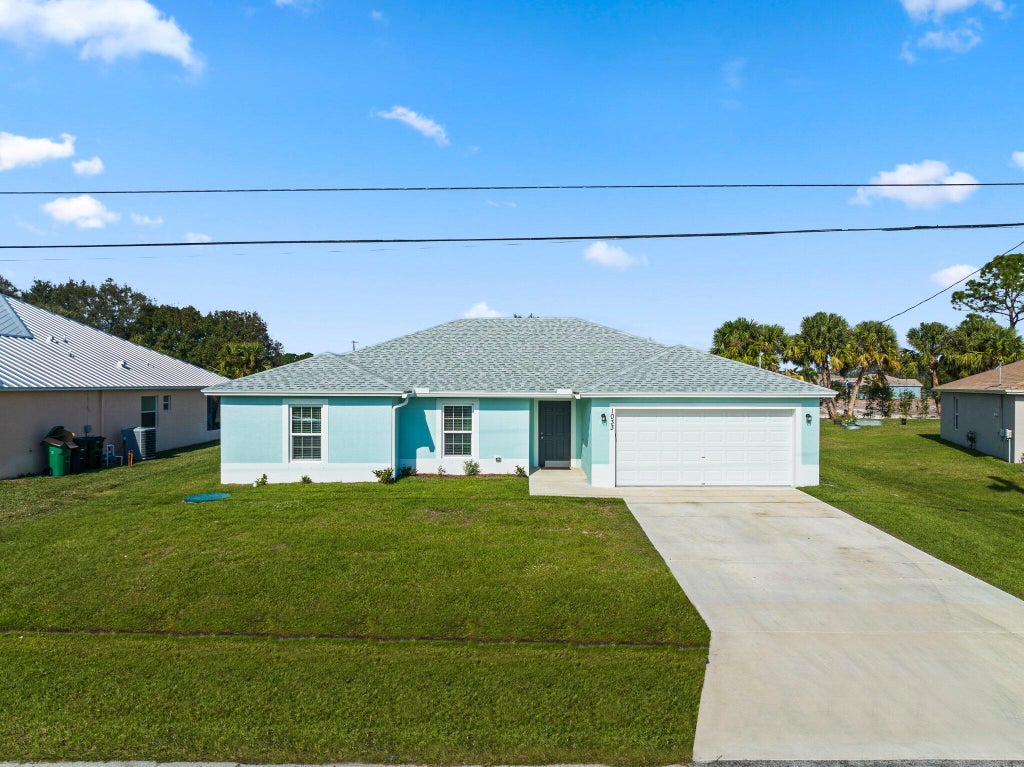 Photo of 1033 SW Ingrassina Avenue, Port Saint Lucie, FL 34953 (MLS # R10949704)