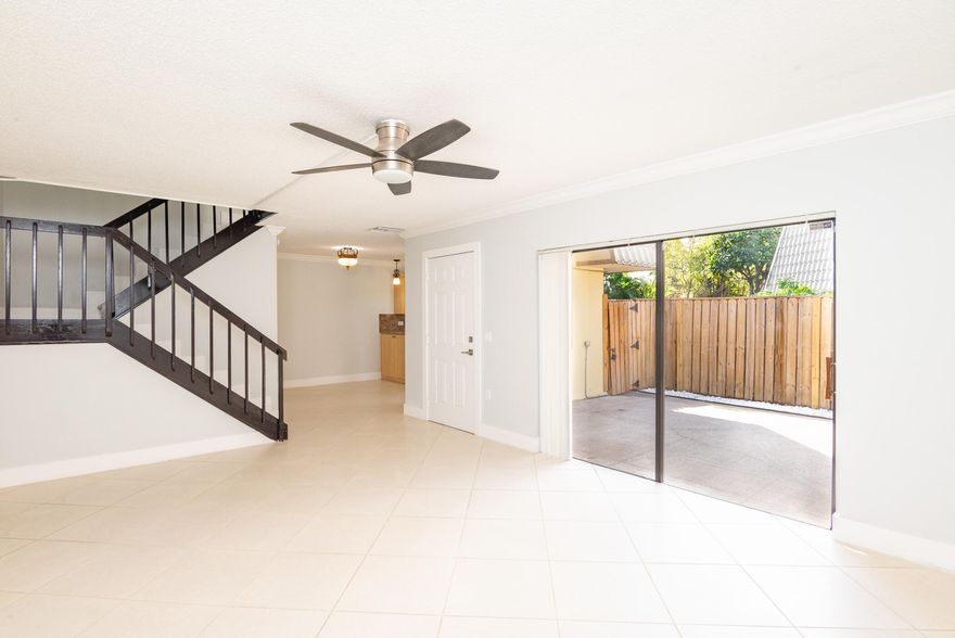 Beautiful & Spacious 3 bedroom 2-1/2 bath Townhouse in gated community. Great Location! Walking distance to the Tanger Outlets, restaurants & shops with a short drive to the airport, Downtown West Palm Beach & beaches. Private fenced in courtyard for plenty of outdoor entertaining. Beautiful Kitchen with stainless steel appliances & beautiful cabinets with ceramic floors throughout. Kitchen, dining area, half bath, living area & 1 bedroom on the lower level. 2 other Bedrooms each with its own full bath on the upper level. Main bedroom has large walk-in closet, shower & dual sinks with Balconies in both bedrooms.  Newer AC, Hot water heater & roof. 2 assigned parking spaces & Beautiful community pool. No waiting period to rent. HOA fee includes water, cable & outside maintenance.