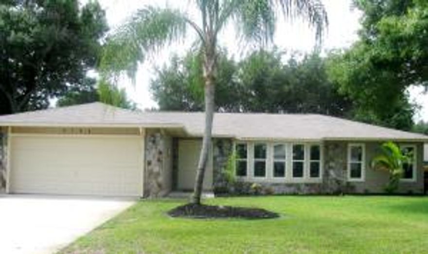 Nicely remodeled with brand new hurricane impact windows & door, elegant granite with accented backsplash in the kitchen along with new sink/faucet, fresh paint inside and out, new carpet and padding and new Carrier 16 seer a/c. Other appointments include cathedral ceiling,alarm system, extra wide master bedrm doorway for wheelchair access, inside laundry rm w/sink, re-screened screen enclosure, addtional screened porch and full sprinkler system with timer, well shaded yard w/3 valuable live oak trees (see attached).Although only 2 bedrooms there is a large den/family room that could easily be converted to a third bedroom.All this and just steps away from the Island Pines Golf Club.Holiday Pines is an established neighborhood close to shopping, dining, parks, beaches, golf and major roadwa