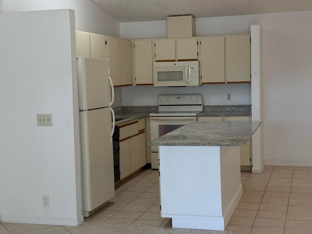 Photo of 4290 Woodstock Drive #D, West Palm Beach, FL 33409 (MLS # R11162368)