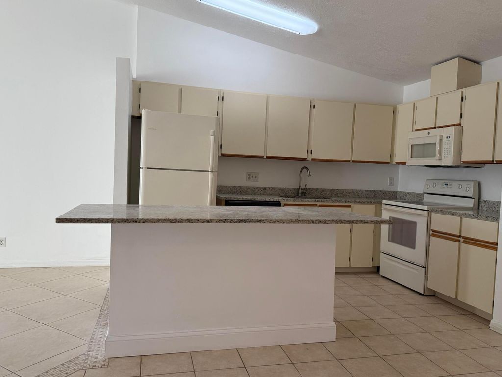 Photo of 4290 Woodstock Drive #D, West Palm Beach, FL 33409 (MLS # R11162368)