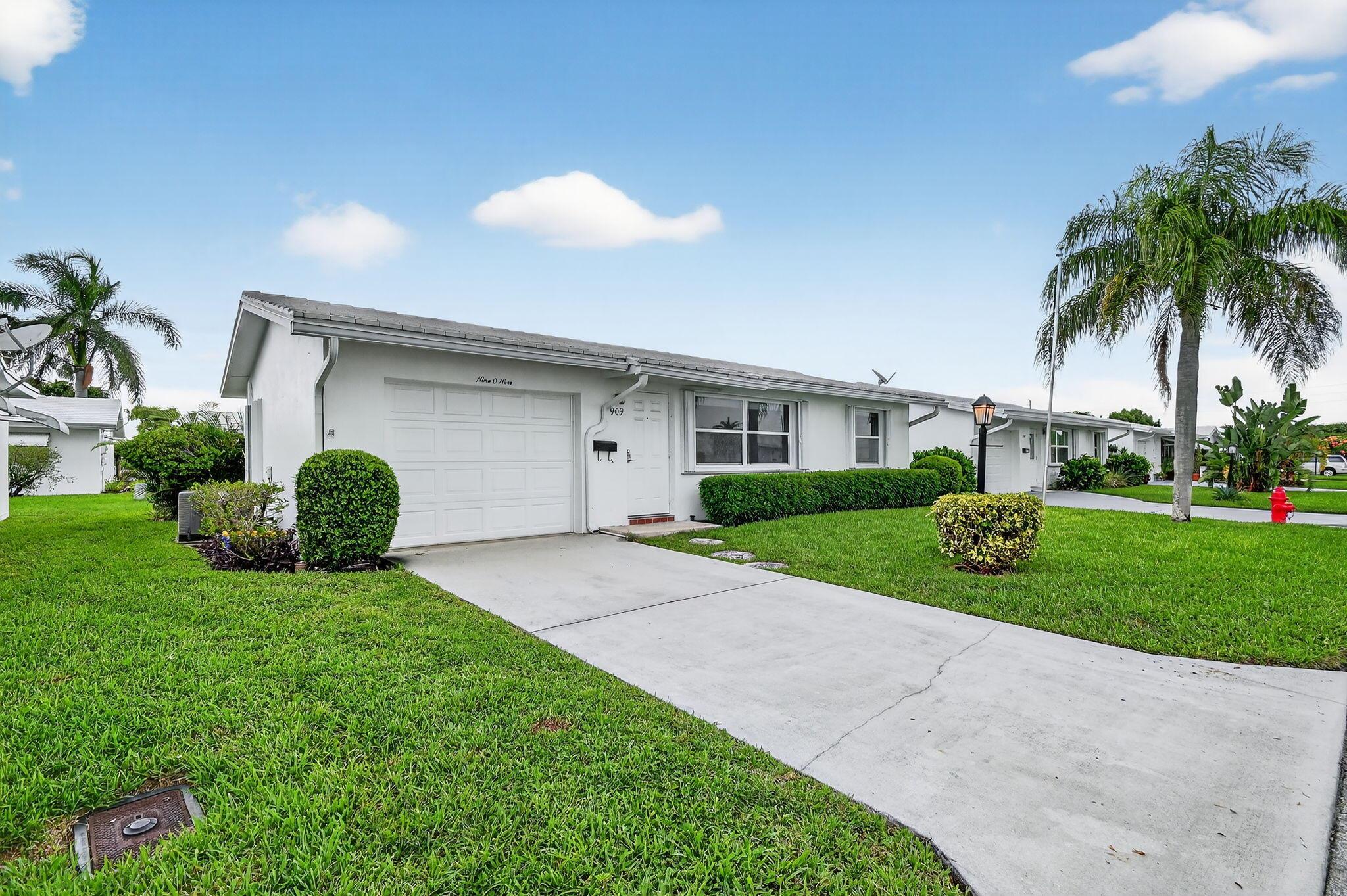 Welcome to Leisureville Living! Step into comfort and convenience with this charming Fairmont model home. This well-maintained 2 bedroom, 1 bath residence includes a 1 car garage, an air conditioned light filled Florida room, offering endless possibilities for your personal touch. Enjoy peace of mind with new central air conditioning, a new hot water heater, and updated windows complete with accordion shutters for storm protection. The renovated bathroom features a beautifully tiled, glass-enclosed shower with a built-in seat. Step out back to serene, open views that offer privacy and the perfect setting for relaxation or entertaining. The recreation lease is paid in full. The amenities are unbeatable with an 18-hole Par 3 golf course, 3 Clubhouses with social events and activities,