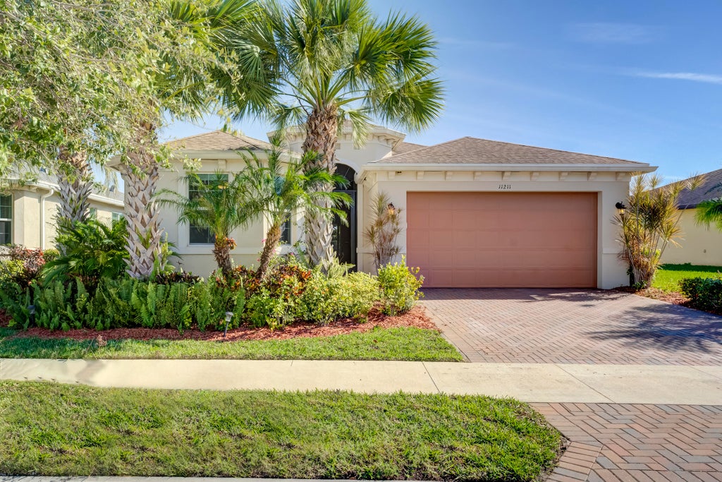 Photo of 11211 SW Lake Park Drive, Port Saint Lucie, FL 34987 (MLS # R11006141)
