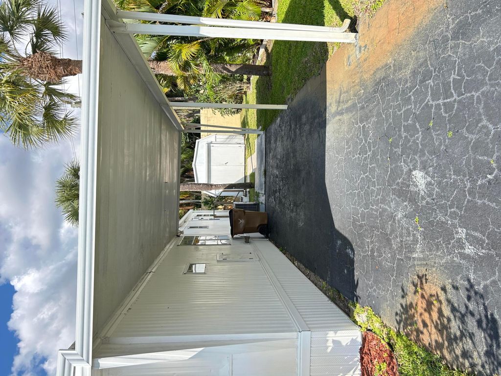 Photo of 615 Alamanda Lane, Deerfield Beach, FL 33442 (MLS # B26007351)