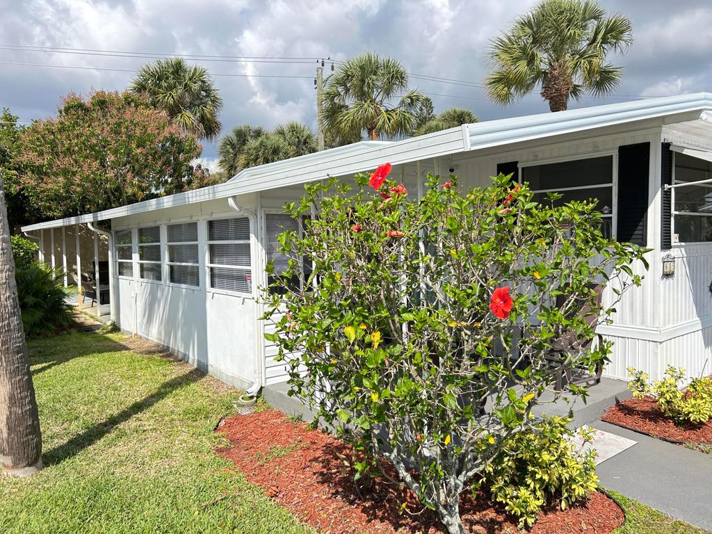 Photo of 615 Alamanda Lane, Deerfield Beach, FL 33442 (MLS # B26007351)