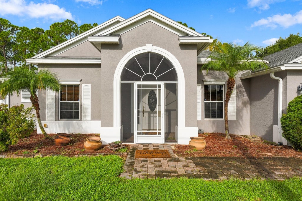 Photo of 3530 SW CONIBEAR Street, Port Saint Lucie, FL 34953 (MLS # B26078099)