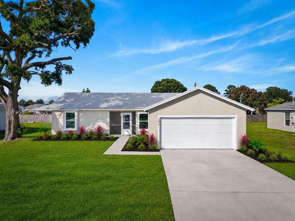 Photo of 1917 SW Flower Lane, Port Saint Lucie, FL 34953 (MLS # B26036681)