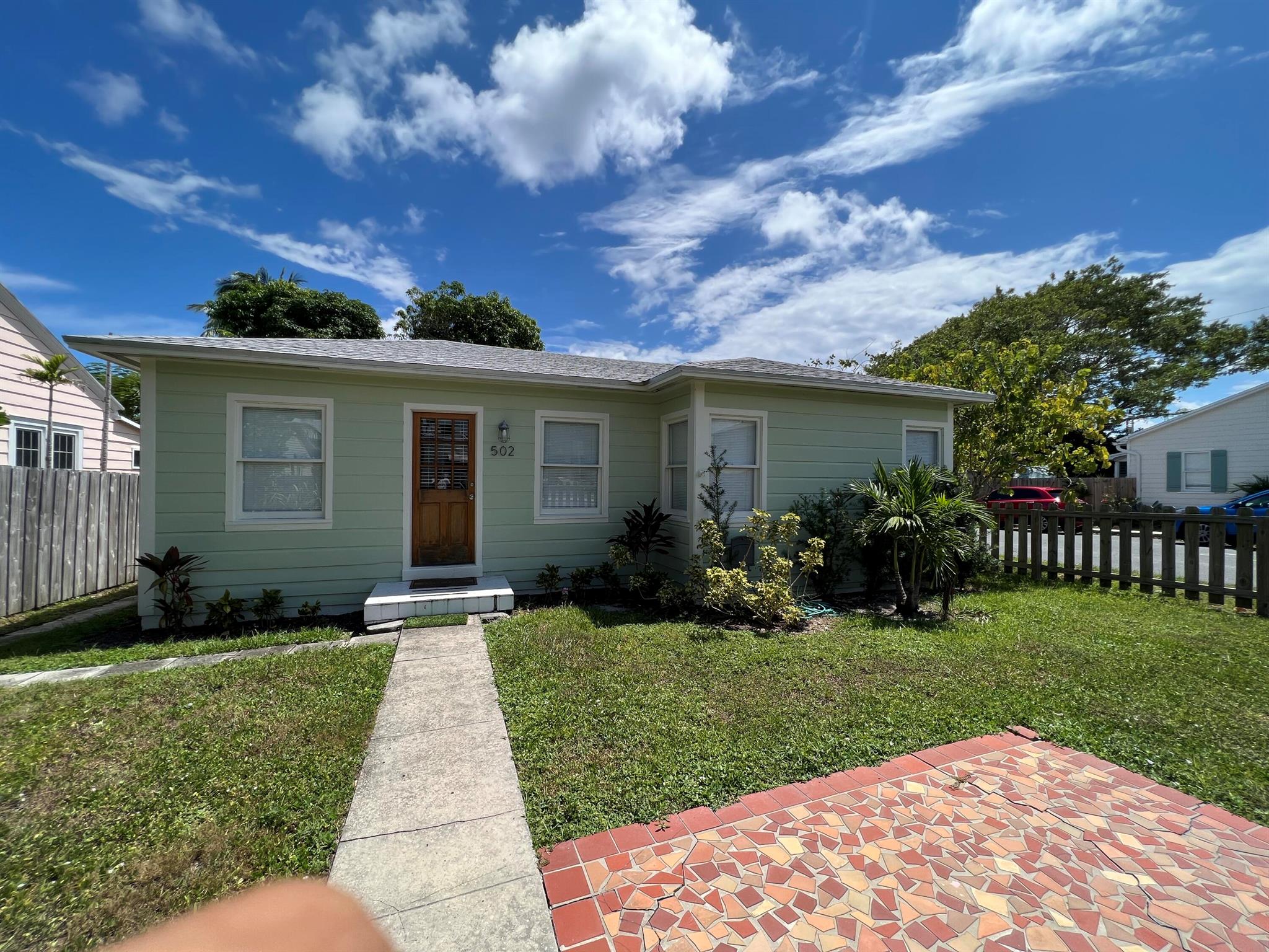 Fantastic opportunity to ''have it your way'' and rent this gorgeous seaside cottage various ways to BEST accomodate your needs! This is an awesome, location with proximity to our very own historic downtown Lake Worth Beach, shops, restaurants, a championship 18 hole golf course, public dock for your boating needs, and any water sports you want to participate in. This home is a true 2 bed 2 bath home with a third bedroom/office/den possibilty. A shed in back for additional storage, off street parking under a carport for sun protection! It is truly light n bright boasting a wide open floor plan, with washer dryer in the unit, all updated very recently and furnished (or not) cottage cute! We ARE pet friendly! There is a fenced yard, quaint patio for evening firepits cocktails and sunsets!