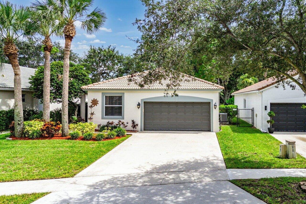 Photo of 196 Seminole Lakes Drive, Royal Palm Beach, FL 33411 (MLS # B26062692)