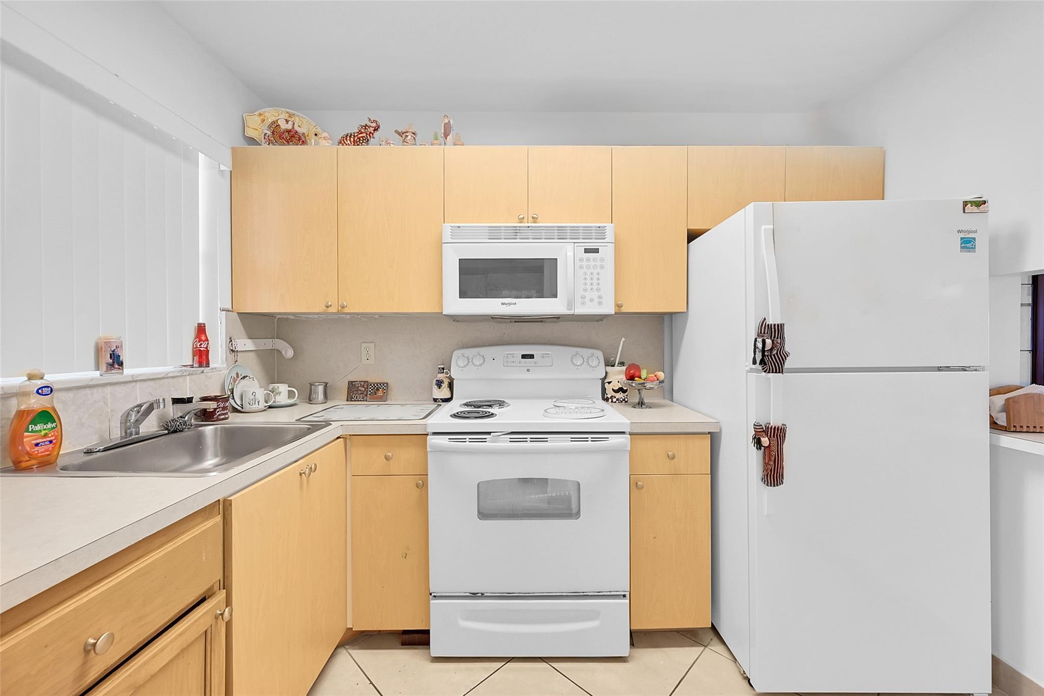 55+ Luxury Community, 2nd floor, well kept building 59. Beautiful redone kitchen with newer appliances. Great view from enclosed balcony. Tile floors throughout this spacious open unit. Rentals are allowed after 1 year of ownership. Perfect for investors. Association requires single applicants earn $25k per year, and a legally married couple must earn $35k per year. At least one person must be 55+ Courtesy call for showings.