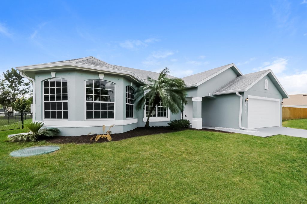 Photo of 612 SW Mccoy Avenue, Port Saint Lucie, FL 34953 (MLS # B26016349)