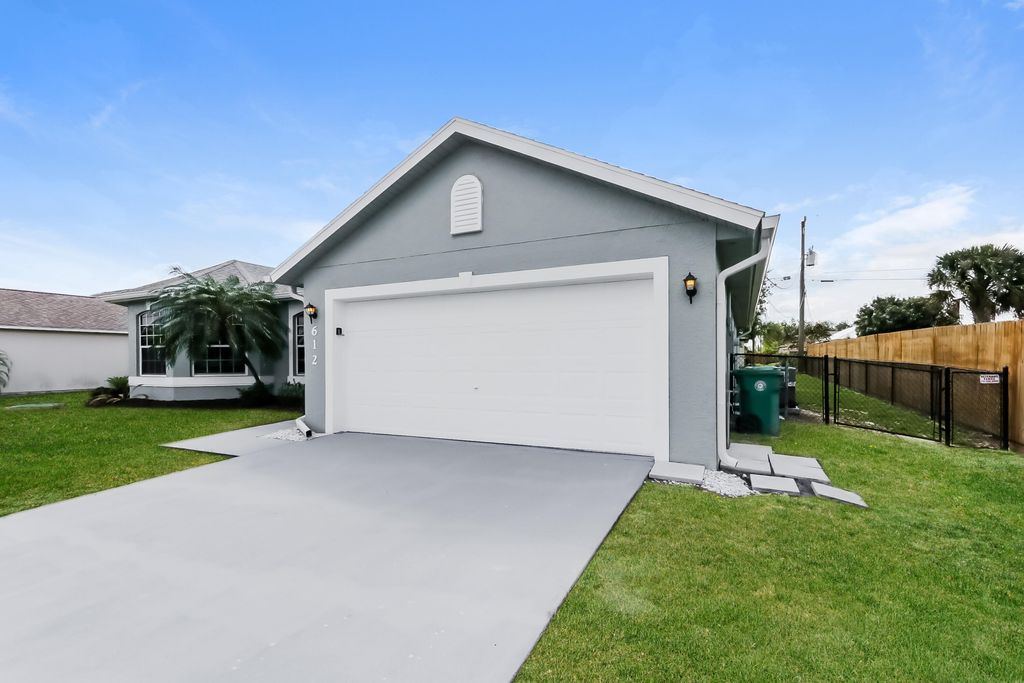 Photo of 612 SW Mccoy Avenue, Port Saint Lucie, FL 34953 (MLS # B26016349)
