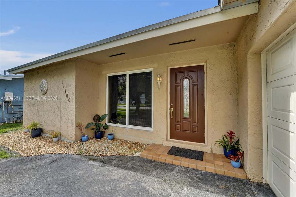 Photo of 11700 NW 33rd Street, Sunrise, FL 33323 (MLS # A12043811)