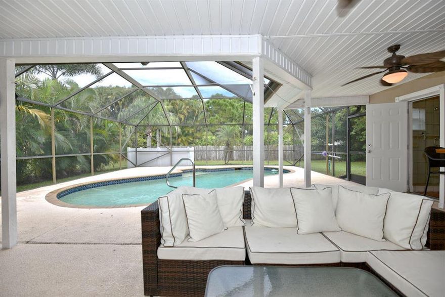 Welcome to Paradise!  Fully updated 3/2 pool home on quiet street that ends on cul-de-sac. Peaceful, tranquil setting.  Home features  cherry hardwood floors throughout, plantation shutters, three sets of  french doors all leading out to patio/pool area. Split floor plan with generous size master suite. Two good size guest bedrooms and updated cabana  bath.  Updated kitchen features custom cabinetry, granite counter tops and top of the line appliances. Family room off kitchen.  Light & bright formal living room and dining room.  Large screened in patio & heated pool add to your family entertainment.  Enclosed outdoor shower and storage shed.  Whole house generator.  Roof top solar panels recently added.  Room for boat/RV on side of house. NO HOA! Won't last. Call text listing agent today!