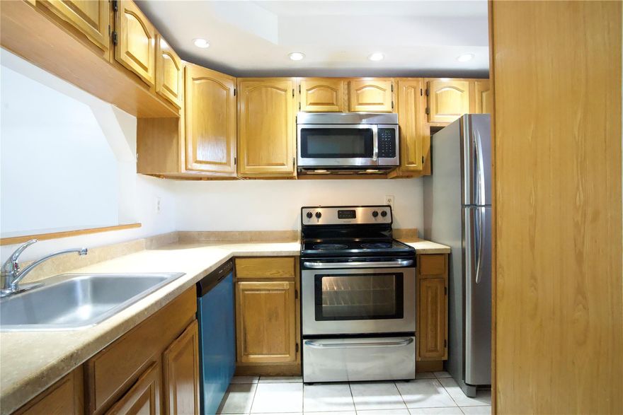 JUST REDUCED! Great opportunity for first-time buyers or investors! This well-maintained condo features a kitchen with stainless steel appliances and plenty of cabinet space, vinyl flooring throughout, and washer & dryer in the unit. Enjoy an open living and dining area filled with natural light, plus a screened patio with an additional storage room.