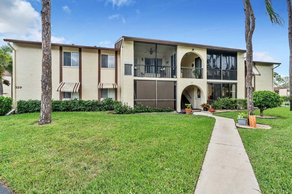 Photo of 329 Knotty Pine Circle #A-2, Greenacres, FL 33463 (MLS # R11034779)