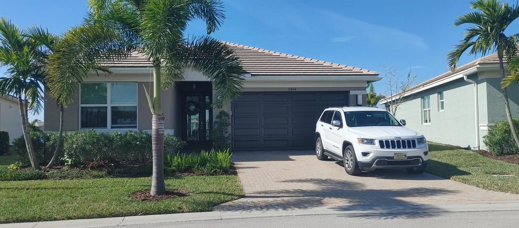 Photo of 11694 SW River Crossing Place, Port St Lucie, FL 34987 (MLS # R10953151)