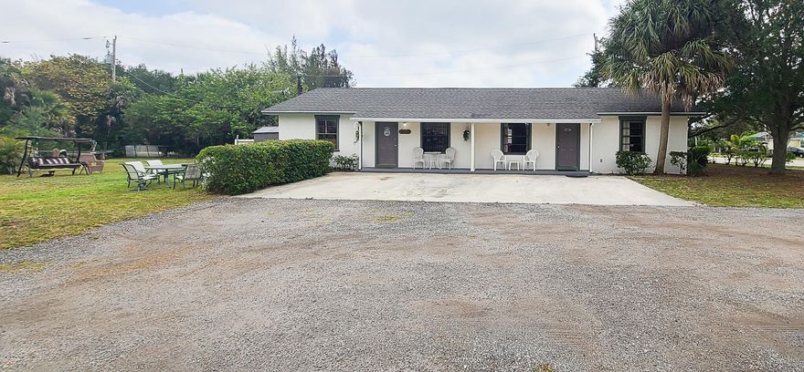 Investment Opportunity!! Large .68-acre corner lot with a well maintained 2BR/1BA duplex with the potential of adding more units on this property. Live in one side and rent the other side for income! Each unit offers inside laundry, and a beautifully appointed kitchen. Entertaining can be done comfortably in the spacious living areas. New HVAC (2024) in both units. Conveniently located just minutes from downtown, PBI airport, shopping, dining and more! Motivated Seller!!