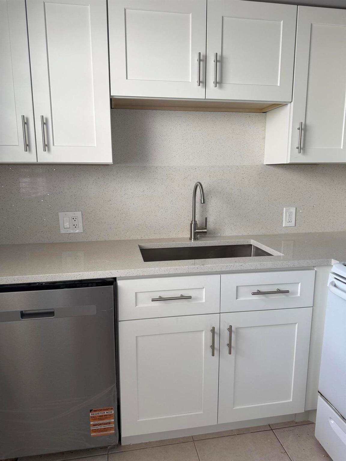 Sought after first floor. Corner unit with extra side windows in dining, kitchen and master. Brand new kitchen cabinets and quartz counters and backsplash. New stainless dishwasher. New stainless micro. No carpet...tiles throuout. Central AIR CONDITIONING. New Water Heater.
