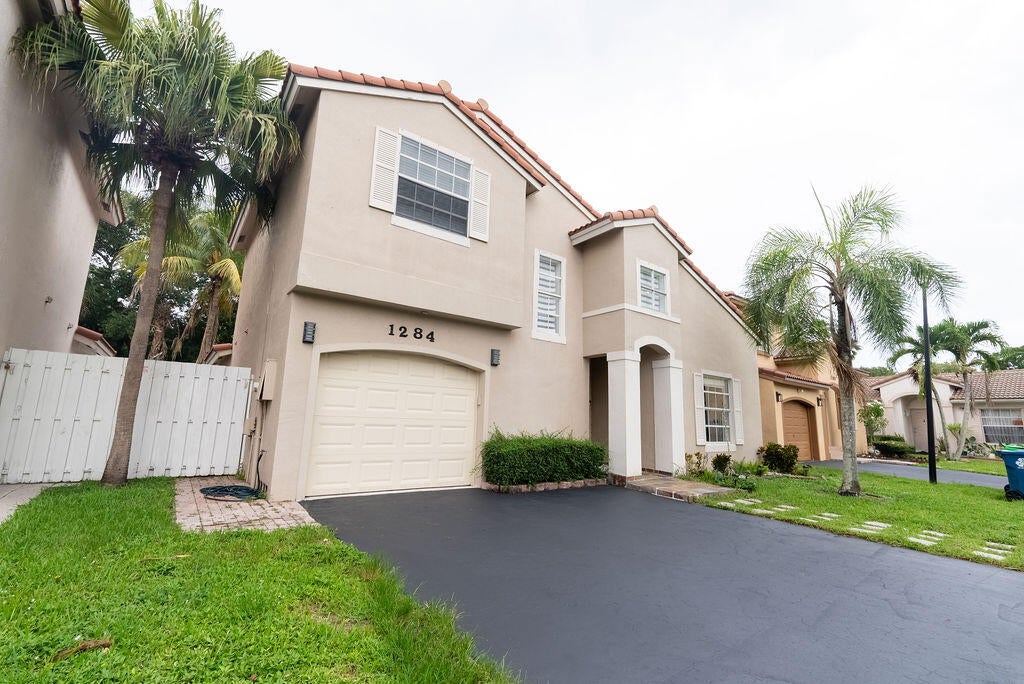 Photo of 1284 NW 125th Terrace, Sunrise, FL 33323 (MLS # B26056552)