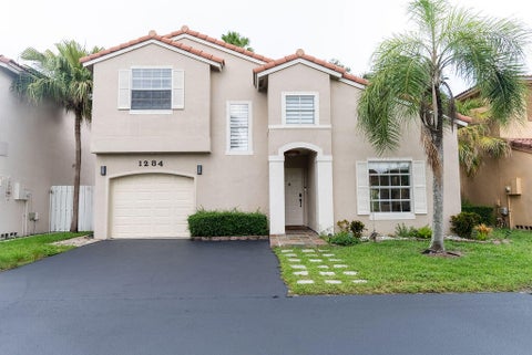Photo of 1284 NW 125th Terrace, Sunrise, FL 33323 (MLS # B26056552)