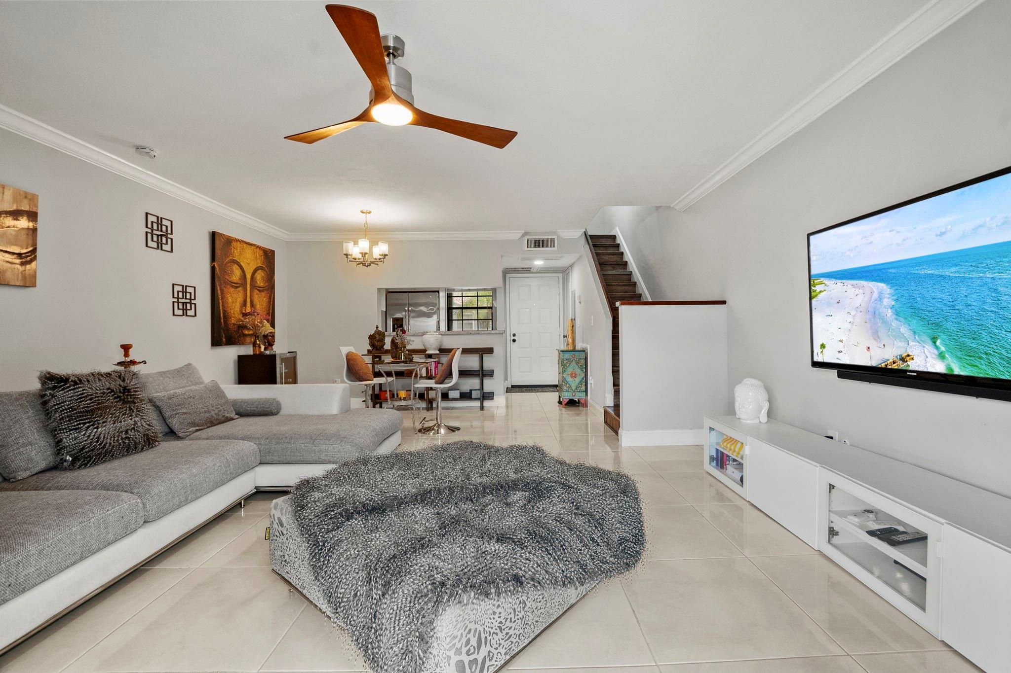 FULLY TURNKEY 2 bedroom 1.5-bathroom townhouse in Pembroke Pines behind Pembroke Lakes Mall! Community recently painted building replaced exterior fence and replaced roofs. No upcoming assessments! Beautiful oversized white tile floors downstairs and laminate wood floors on the stairs & upstairs. Master suite includes large walk-in closet, sitting area and bathroom vanity. Full size stackable washer and dryer located inside your home! Large family room with dining room. Kitchen features Shaker white cabinets, light granite tops, stainless appliances and a bar overlooking the dining area. Inside A/C replaced 2024. 1 assigned parking space and plenty of guest spaces. Conveniently located near shopping, hospitals and highways! Association requires minimum 650 credit score. FHA/VA welcome!