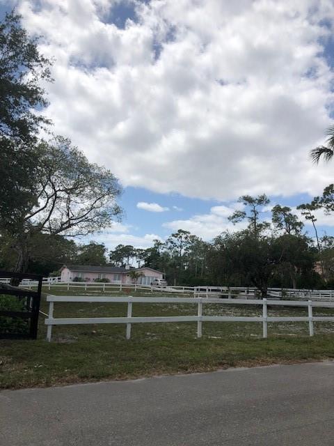 This is a 2.5 acre lot with an olympic size pool, horse stalls in the back and a run in the front.
PRICE IS BASED ON LAND VALUE ****Zoned for Agriculture.**** The home has newer roof and a/c
however everything else needs to be updated and needs work.