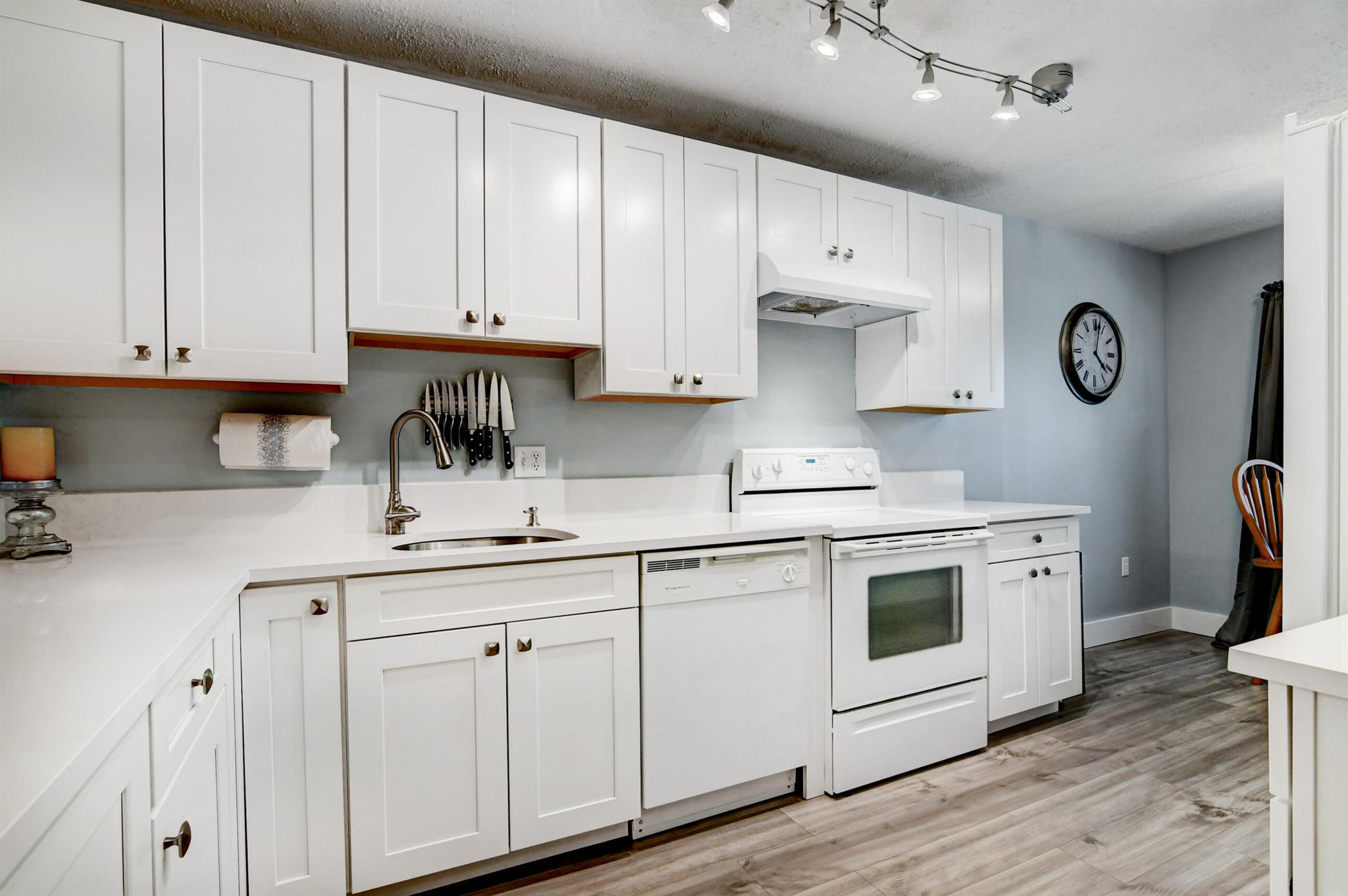 *Membership Required* Lovely waterfront condo in Hunters Run. Renovated & Move-In Ready! This 2-bedroom, 2-bathroom condo offers a spacious 1,388 sq. ft. of living space, with an additional 192 sq. ft. screened-in balcony, bringing the total to 1,580 sq. ft. Enjoy serene water views, lush banyan trees, and birdwatching while sipping morning coffee from your private balcony.The eat-in kitchen boasts white shaker cabinetry, sleek white quartz countertops, and modern finishes. Brand new wood-look plank flooring flows throughout the main living areas, creating a stylish and cohesive look.Need extra storage? This unit has you covered! It features a large pantry, a master bedroom with a walk-in closet plus two additional closets