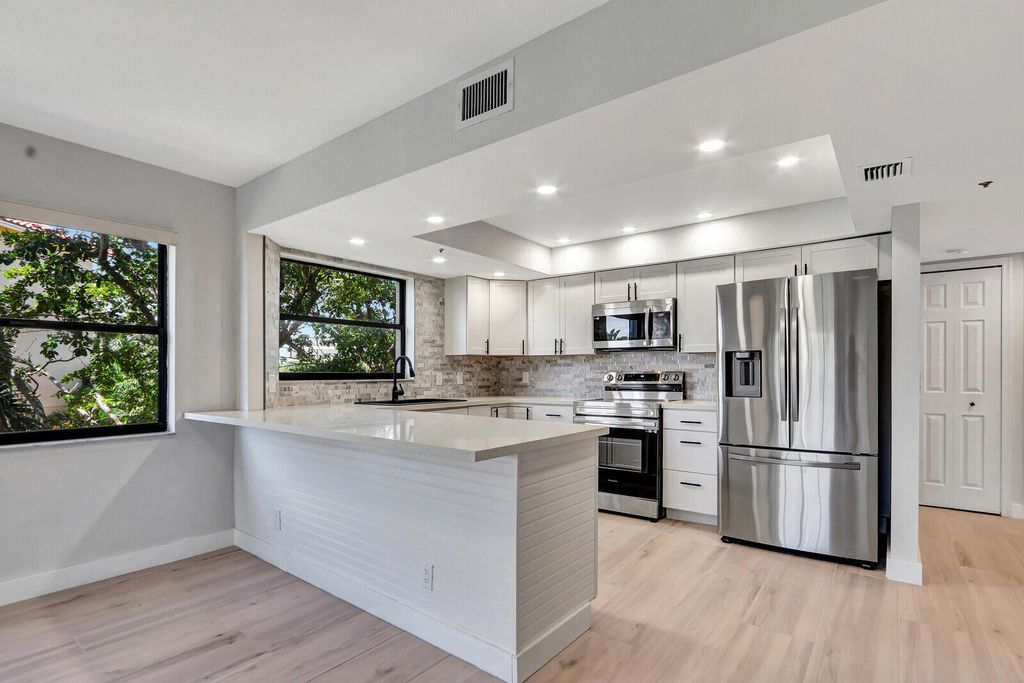 Photo of 700 Uno Lago Drive #301, Juno Beach, FL 33408 (MLS # R11130943)