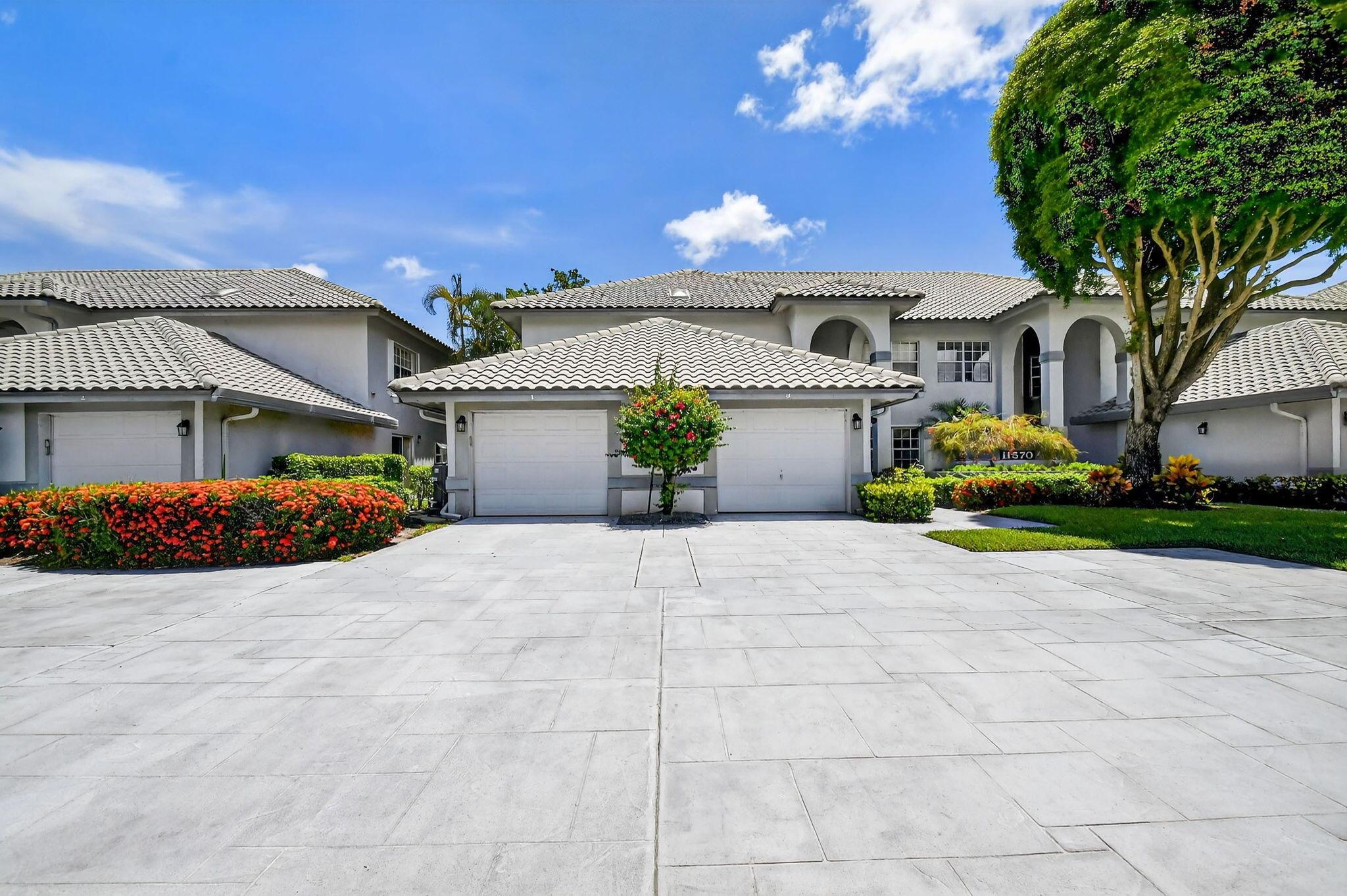 STEP INTO THIS 2/2/1-CG 1ST FLOOR CONDO &, YOU'LL LOVE THE TREMENDOUS SIZE OF THE GREAT ROOM THAT LOOKS OUT TO A PANORAMIC VIEW OF LUSH GREENERY & TREES. AN EXTRA WIDE ENCLOSED PATIO W/ A/C FOR YEAR-ROUND USE W/ MOTORIZED SHUTTERS & IMPACT SLIDERS BRING AN ABUNDANCE OF NATURAL SUNSHINE TO THE OPEN FLOOR PLAN. THE UPDATED EAT-IN KITCHEN IS ADORNED W/ NEW HIGH-END APPLIANCES, GRANITE COUNTERTOPS & TILE BACK SPLASH. 2ND OUTDOOR PRIVATE PATIO OFF KITCHEN. ADDITIONAL DESIGN FEATURES INCLUDE TILE ON THE DIAGONAL IN LIVING AREAS, TRAY CEILING IN DINING AREA & FAUX WOOD FLOORING IN BEDROOMS. LARGE PRIMARY SUITE BOASTS PLANTATION SHUTTERS, ORGANIZED CLOSETS, PULL-OUT SHOE RACK & ROMAN TUB. ADDITIIONAL UPGRADES INCLUDE NEW WASHER & DRYER & ACCORDION SHUTTERS. SEE FOR YOURSELF & MAKE IT YOUR HOM