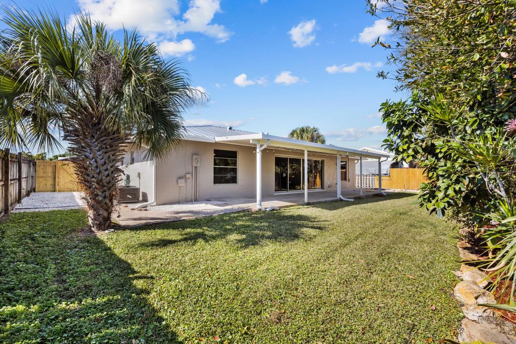 Photo of 8993 SE Sandridge Avenue, Hobe Sound, FL 33455 (MLS # R11163786)