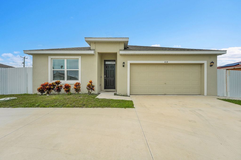 Photo of 418 NW Airoso Boulevard, Port Saint Lucie, FL 34983 (MLS # R11119605)