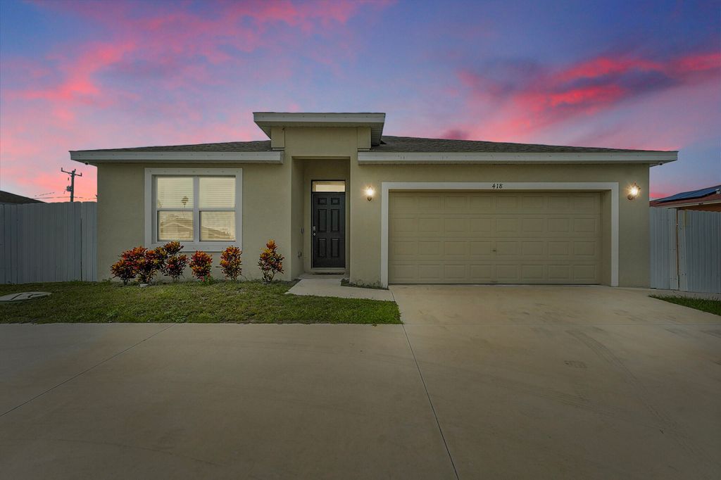 Photo of 418 NW Airoso Boulevard, Port Saint Lucie, FL 34983 (MLS # R11119605)