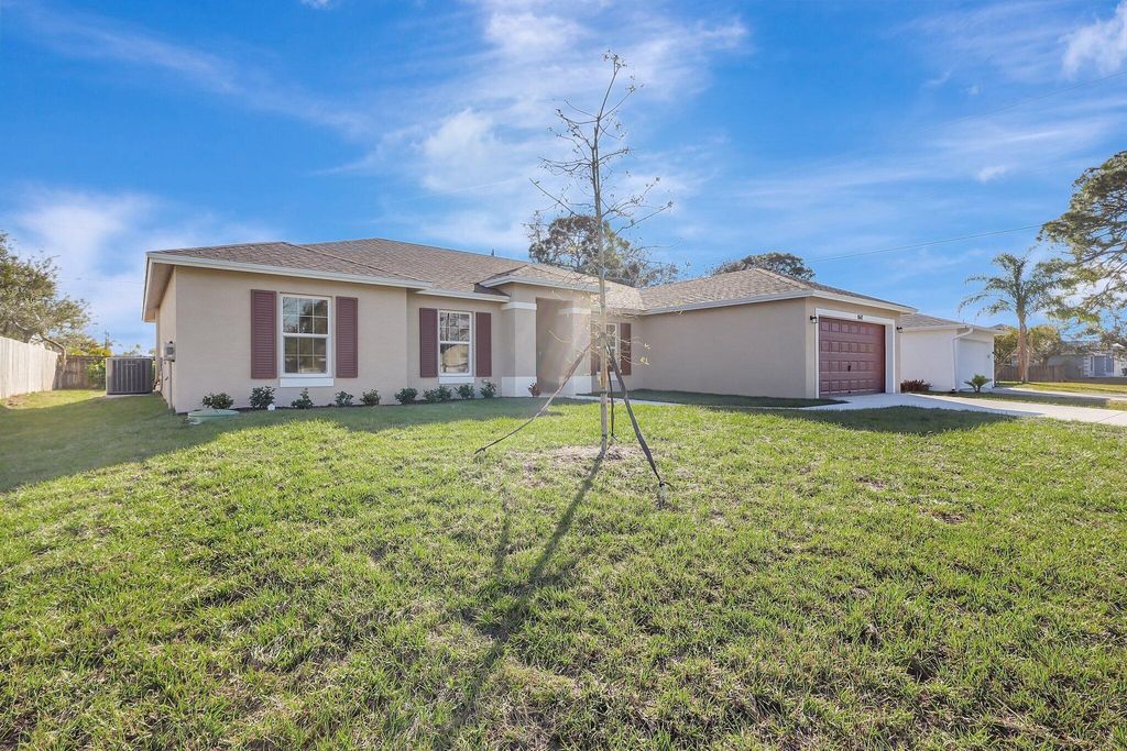 Photo of 3965 SW Mccain Street, Port Saint Lucie, FL 34953 (MLS # B26009372)