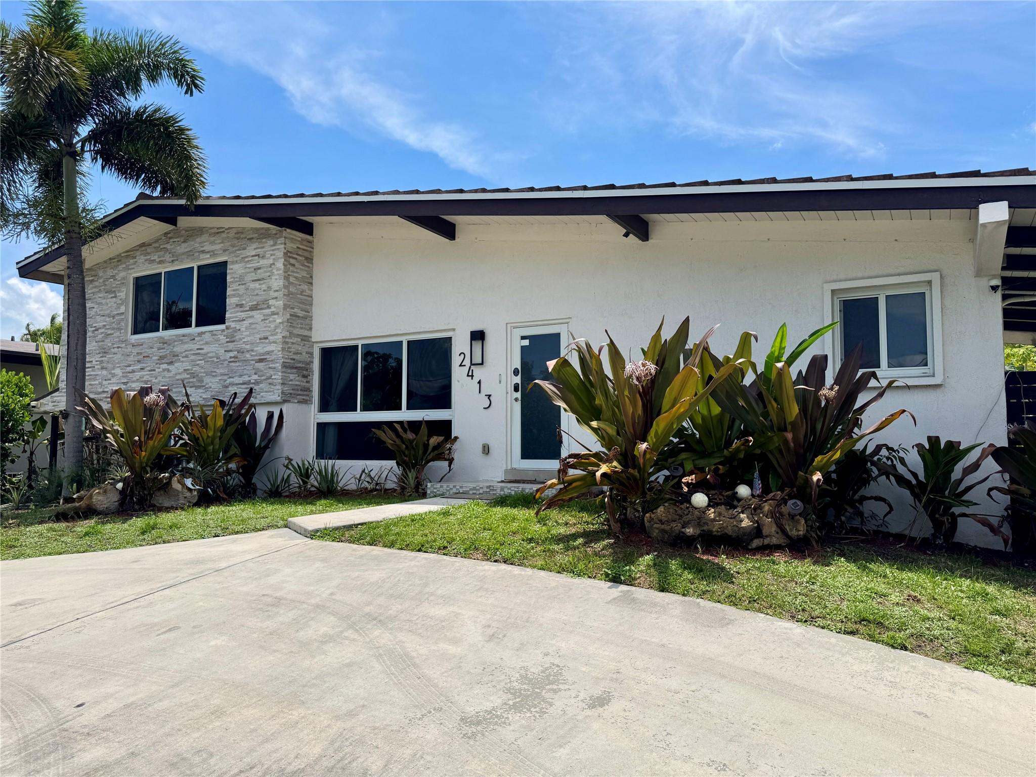 MUST SELL!!! Priced Below "Assessors Just Market Value" of $1,025,870. HUGE Tri-level Pool Home with 53ft of Waterfront and Direct Ocean Access. Inside, the 3-bedroom, 2.5-bath open split-level floor plan features two master suites with updated baths, tile flooring throughout the main living areas, and laminate in the upper levels. The chef’s kitchen boasts stainless steel appliances, double wall ovens, quartz countertops, and flows into both the family and formal dining rooms. Step outside to your oversized, fenced backyard with a sparkling pool, lush tropical landscaping, and panoramic water views – perfect for entertaining or relaxing in total privacy. Prime location just minutes to beaches, downtown Fort Lauderdale, FLL airport, and major highways. Newer Roof (2021)