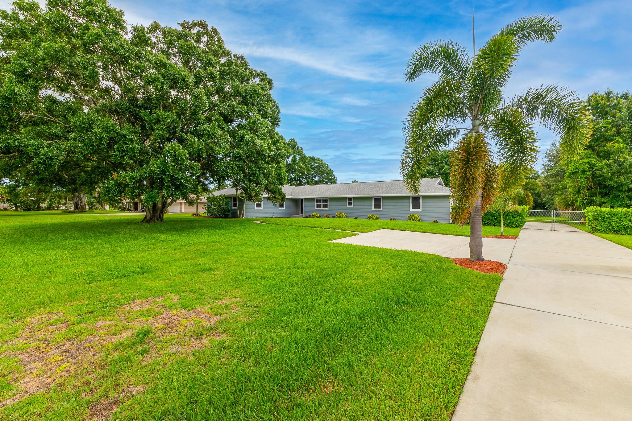 Bring Your Toys to This Modern Oasis & No HOA! Fully Renovated 4-Bed, 3-Bath, Oversized 3-Car Garage Pool Home Nestled On 1.1 Private Acres in Vero Beach. Tucked Away on a Quiet Private Road (Suburban Acres West), This Energy-Efficient Home Has Been Remodeled from the Ground Up and Offers the Perfect Blend of Modern Design, Space, and Serenity. Inside, It's Bright, Open, and Move-In Ready. The Kitchen Has Quartz Counters, Stainless Steel Appliances, Shaker Cabinets, and a Great Layout That Flows into The Main Living Space. You'll Find a Full Laundry Room with a Tiled Bathroom and Glass Shower, Plus Another Bathroom with Double Sinks and a Tub--Ideal for Guests or Kids. The Primary Bedroom Has Two Closets and a Nicely Updated Bathroom That's Clean, Modern, and Functional. Outside Is Where